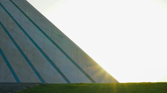 The Azadi Tower in Tehran captured with the sunrise illuminating its iconic architecture.
