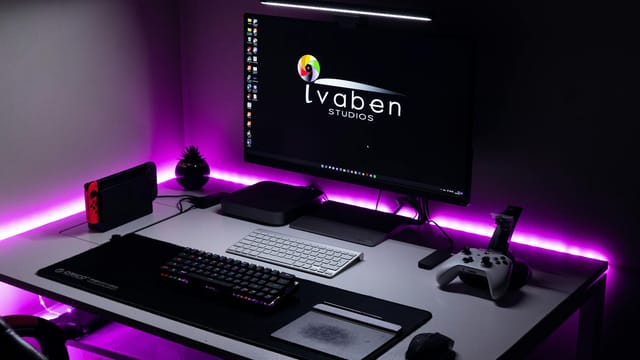 A stylish gaming area featuring LED lighting, gaming console, and modern peripherals.