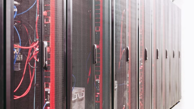 Illustrative image: System with various wires managing access to centralized resource of server in data center