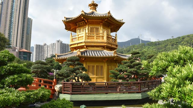 Explore the serene beauty of the Golden Pagoda in Nan Lian Garden, set against a modern skyline.