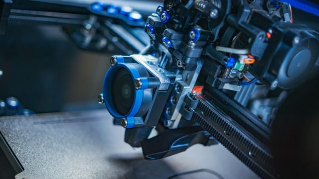 Detailed view of a high-tech 3D printer mechanism showcasing precision engineering.