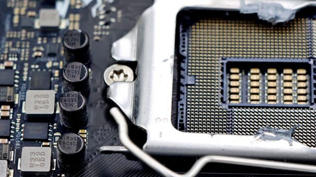 Detailed close-up image of a CPU socket and components on a motherboard.
