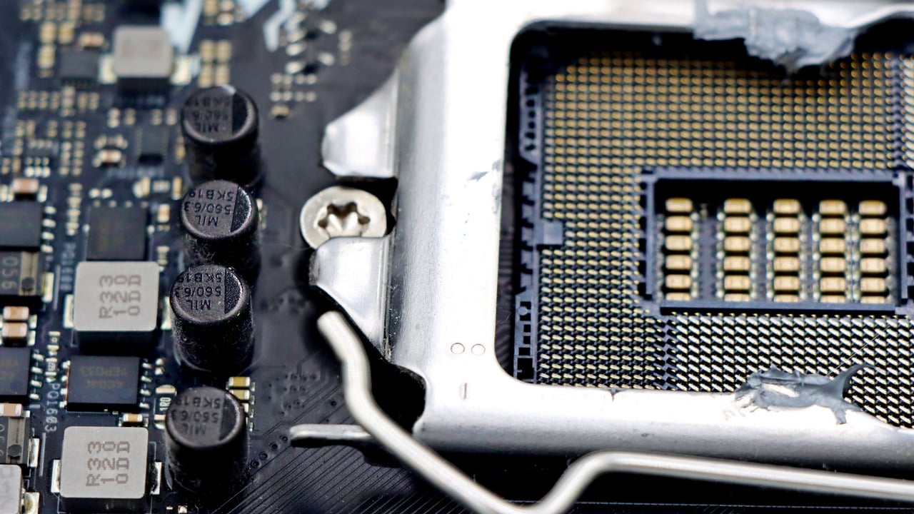 Detailed close-up image of a CPU socket and components on a motherboard.