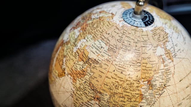 Close-up of a vintage style globe with a focus on Asia and surrounding regions.