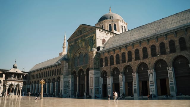 A breathtaking view of the Umayyad Mosque's courtyard in Damascus, showcasing its iconic architecture and cultural significance.