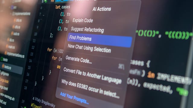 Close-up of AI-assisted coding with menu options for debugging and problem-solving.