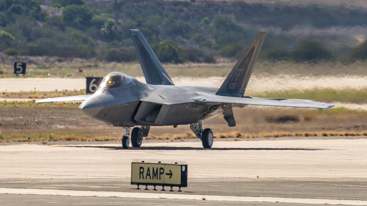 An F-22 Raptor jet fighter stationed on a runway during the Miramar Airshow in San Diego.