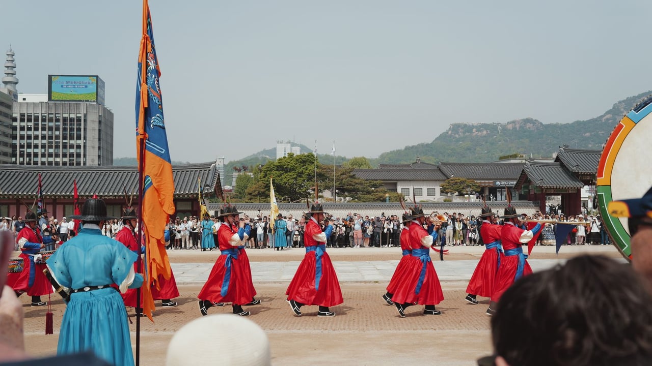 Vibrant traditional guard ceremony at a palace in Seoul, South Korea, showcasing cultural heritage.