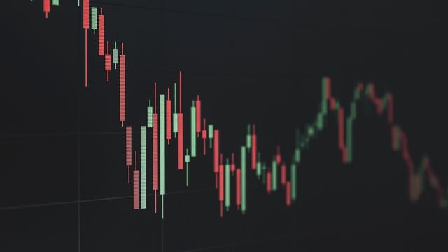 Stock market data chart showing trends in red and green. Perfect for financial and business themes.