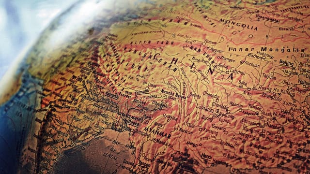 Explore the intricate details of China and neighboring regions in this vintage-style globe photo.