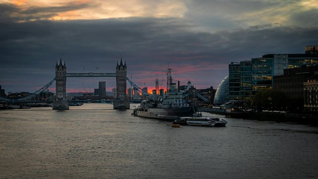 Captivating sunset view over Tower Bridge, with the River Thames and cityscape in London, UK.