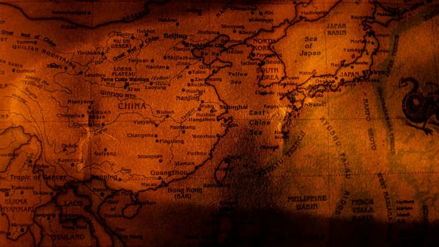 A close-up vintage map showing East Asia with sepia tones, highlighting China, Japan, and Korea.