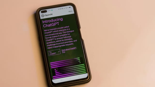 Smartphone screen showing ChatGPT introduction by OpenAI, showcasing AI technology.