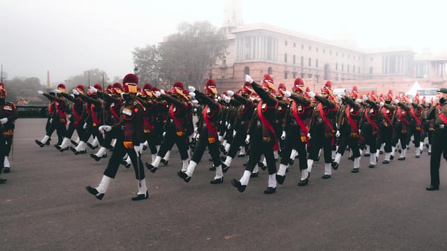 Indian soldiers in ceremonial uniform march during a Republic Day parade.