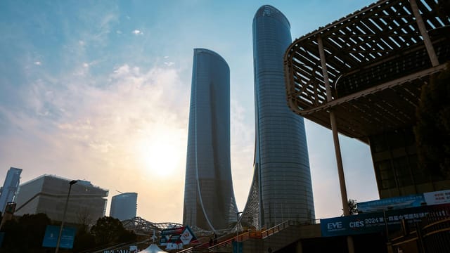 Stunning view of Hangzhou Century Center skyscrapers at sunset, showcasing modern urban architecture.