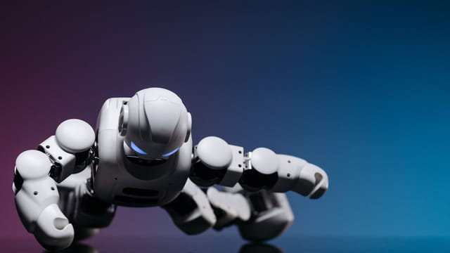 A close-up of a futuristic white robot performing a push-up on a glossy surface against a gradient backdrop.