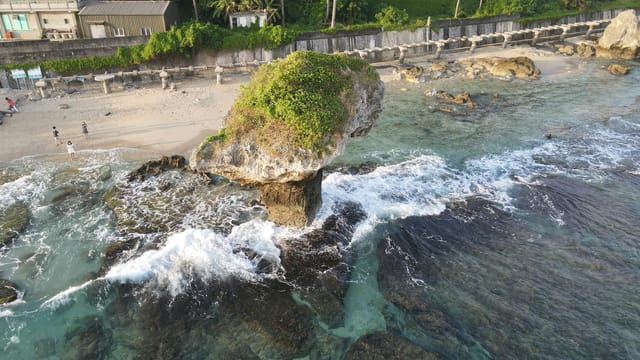 Capture of a unique rock formation along the coast in Taiwan with ocean waves crashing.