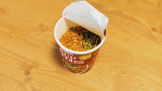 Delicious cup of instant noodles ready to prepare, showcasing Japanese fast food culture.