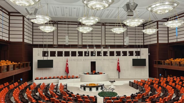 Wide view of the Turkish Parliament interior in Ankara showcasing its modern design and grand architecture.