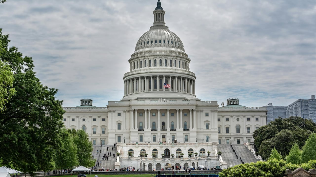 Striking view of the US Capitol sitting majestically in Washington, DC, under a cloudy sky.