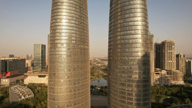 Aerial view of Chengdu Twin Towers during sunset, highlighting modern architecture in Chengdu, China.