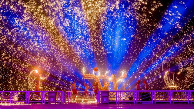 Vibrant festival performance with sparks and lights in Changzhou, China.