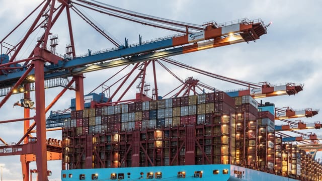 Illustrative image: A cargo ship loaded with containers at Hamburg's bustling commercial dock.