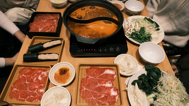 Savor a classic Japanese hotpot meal with fresh ingredients in Toyohashi, Japan.