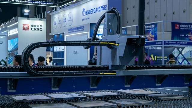 A view of advanced industrial machinery displayed at a trade fair exhibit.