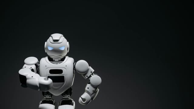 A sleek white robot showcasing modern robotics technology against a dark backdrop.