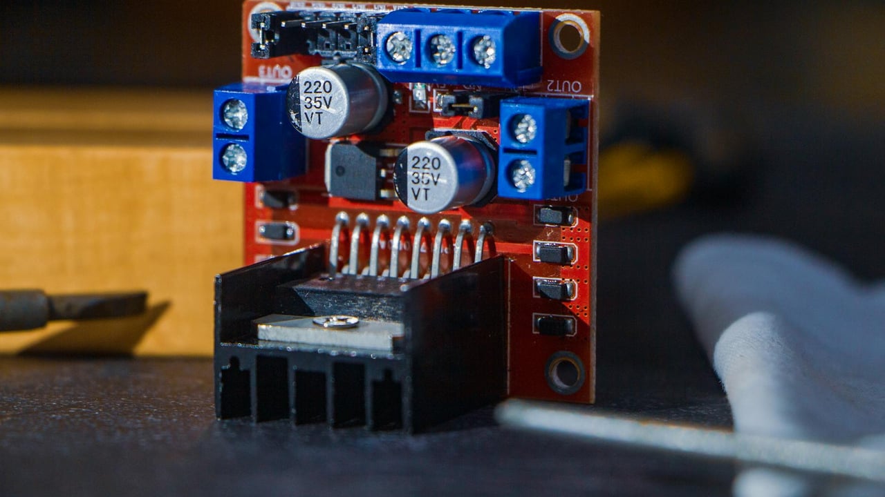 Detailed view of a robotics component with capacitors and connections, captured in Dhaka, Bangladesh.