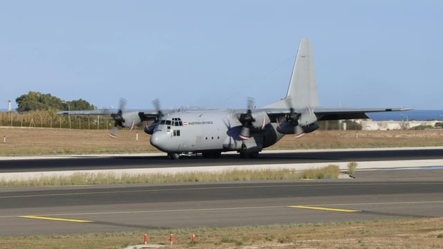Lockheed C-130 Hercules of Austrian Air Force on runway at daytime.