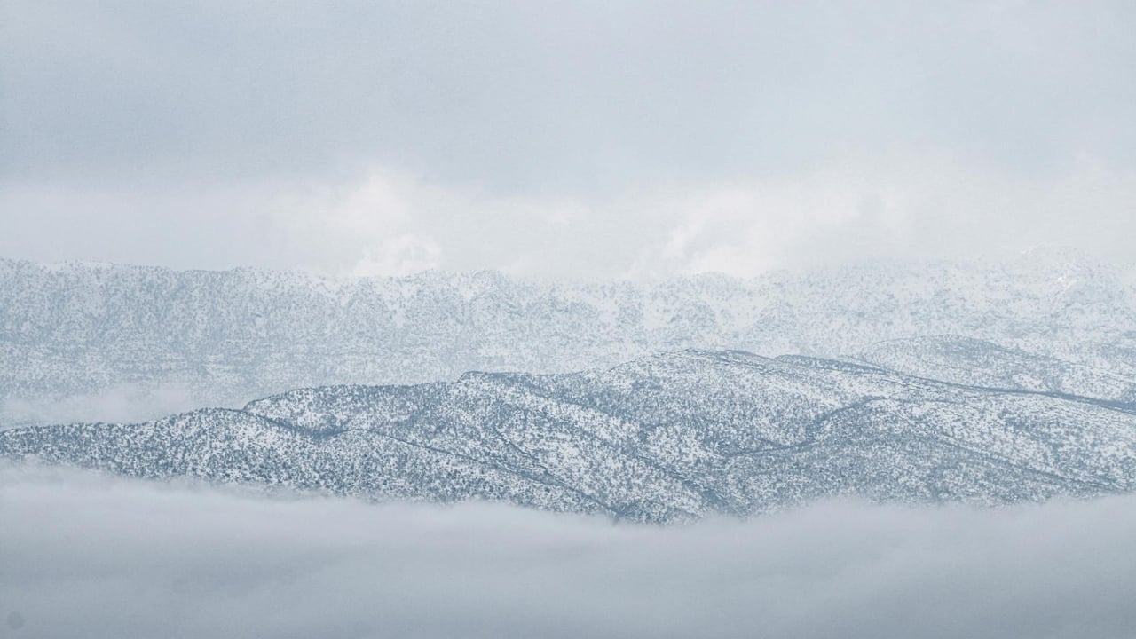Serene winter landscape of snow-covered mountains in Sersink, Duhok, Iraq.