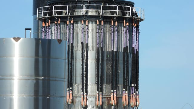 Close-up of a steel structure at SpaceX Starbase in Brownsville, Texas, under a clear blue sky.