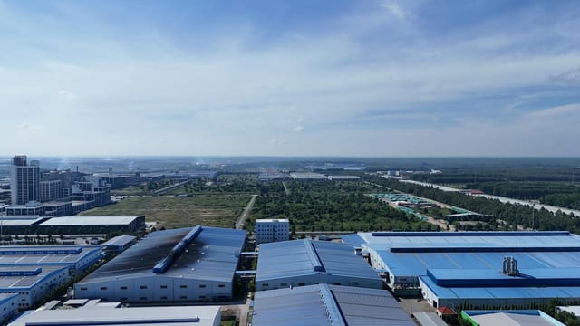 Aerial perspective showcasing industrial buildings and greenery in Bình Dương, Vietnam.