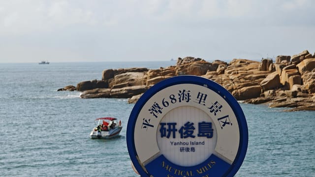 Explore the rugged beauty of Yanhou Island with its striking rocky coastline and serene waters.