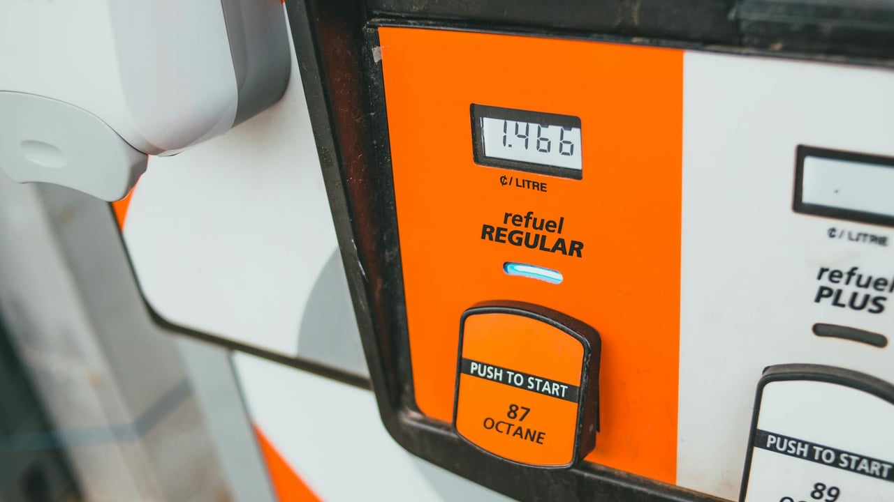 Detailed view of a gas pump showing price and octane level 87.