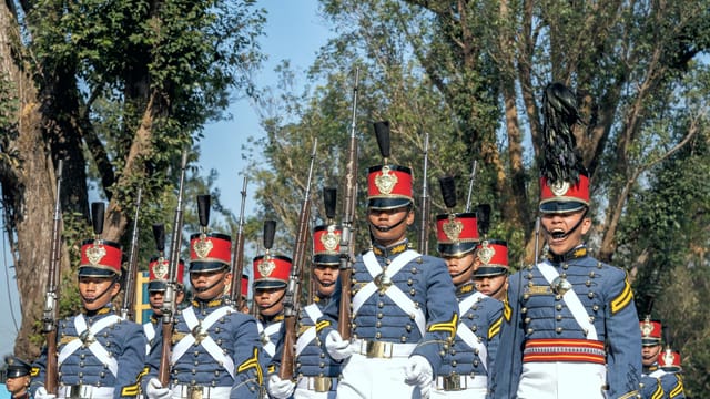 A disciplined military parade in Baguio City, showcasing soldiers in uniform marching outdoors.
