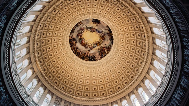 Stunning view of the United States Capitol Rotunda's ornate dome from below.