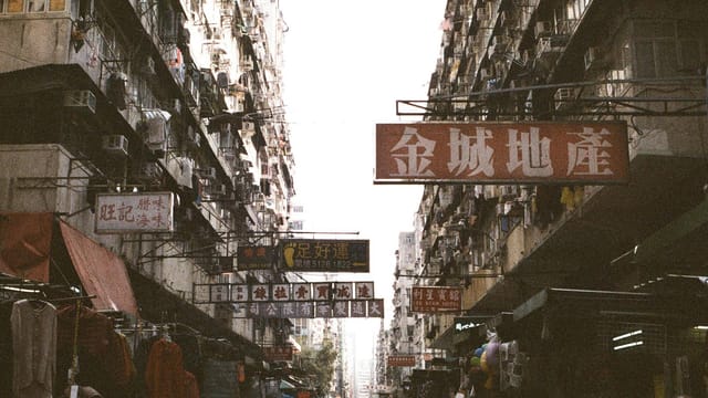 Explore the vibrant atmosphere of Sham Shui Po's street market in Hong Kong, capturing daily life and urban energy.
