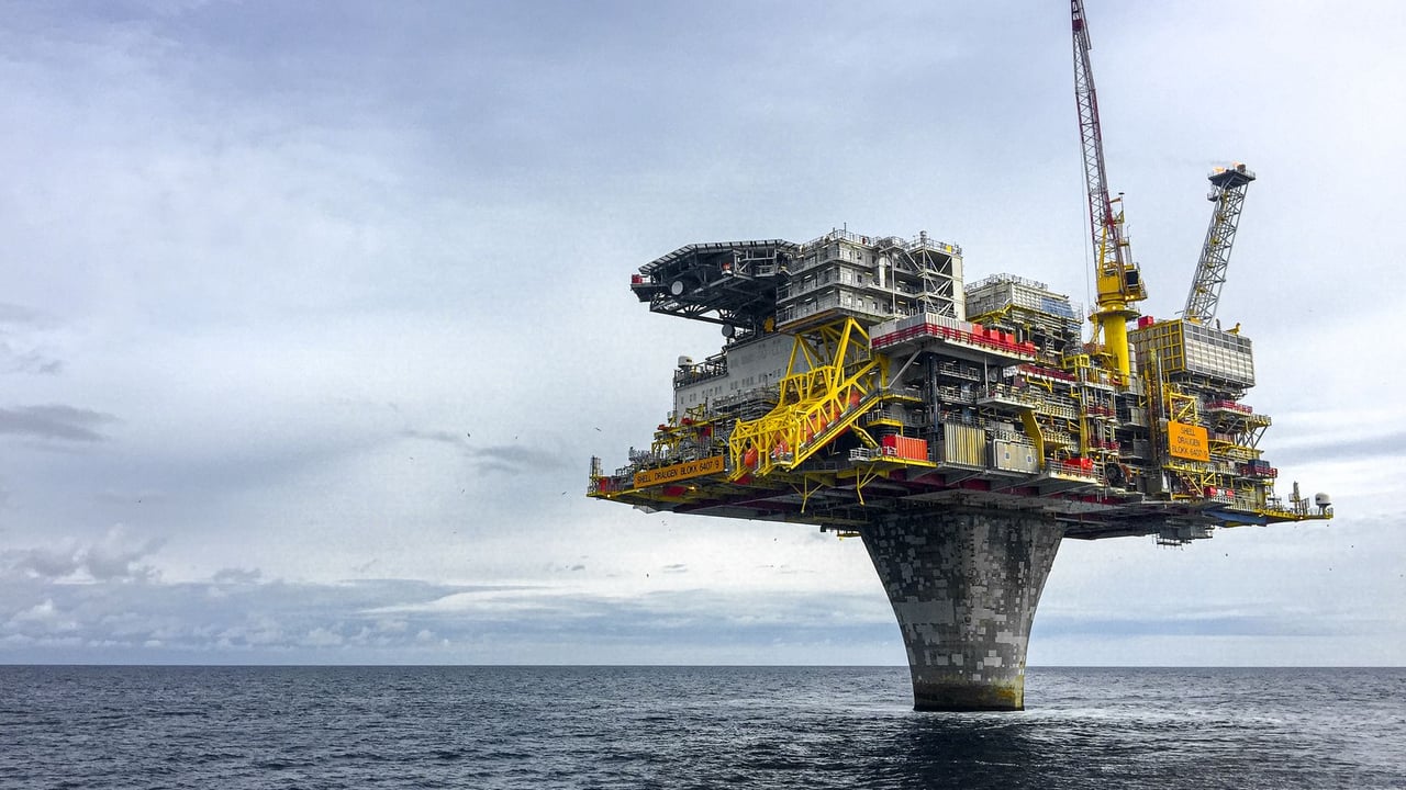 Dramatic view of a large oil platform in Norway's North Sea, symbolizing offshore industry.