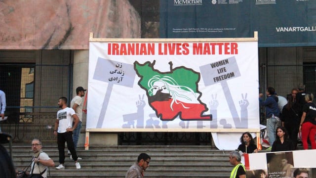 Peaceful protest in Vancouver for Iranian lives, highlighting freedom and unity.