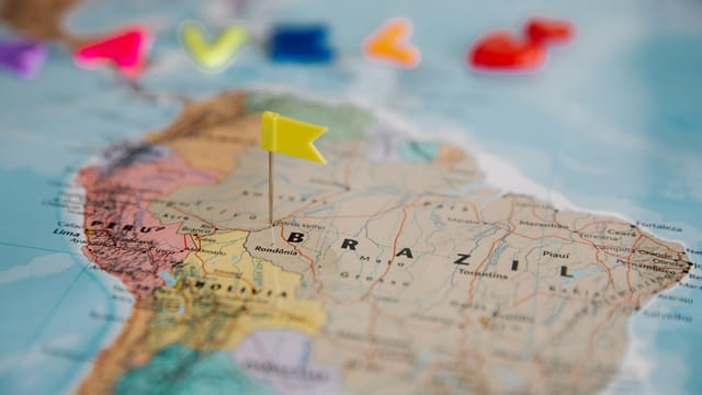 Detailed close-up map of South America highlighting Brazil with a yellow flag pin.