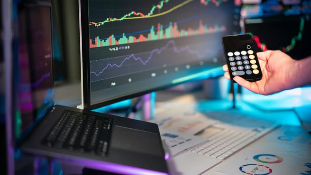 A vibrant setup showcasing financial analytics on screens, ideal for fintech themes.