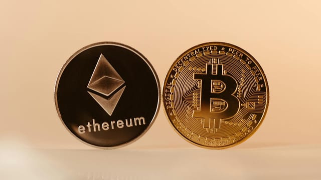Close-up of Ethereum and Bitcoin coins representing modern digital currency and blockchain technology.