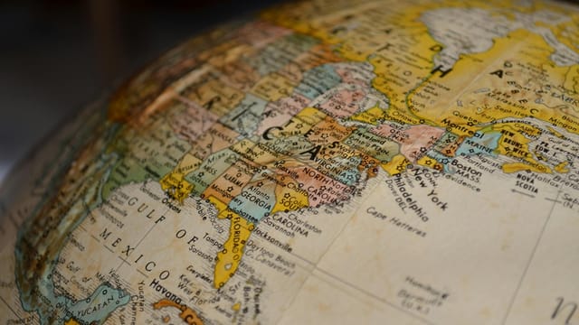 High-resolution close-up of North America on a vintage globe, showcasing detailed geographical features.