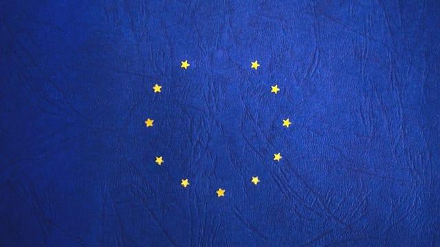 European Union flag with missing stars representing Brexit concept.