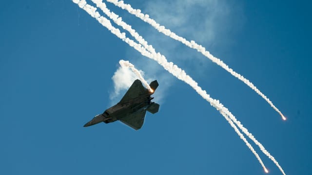 Spectacular fighter jet with flares at an air show in Fairfield, California.