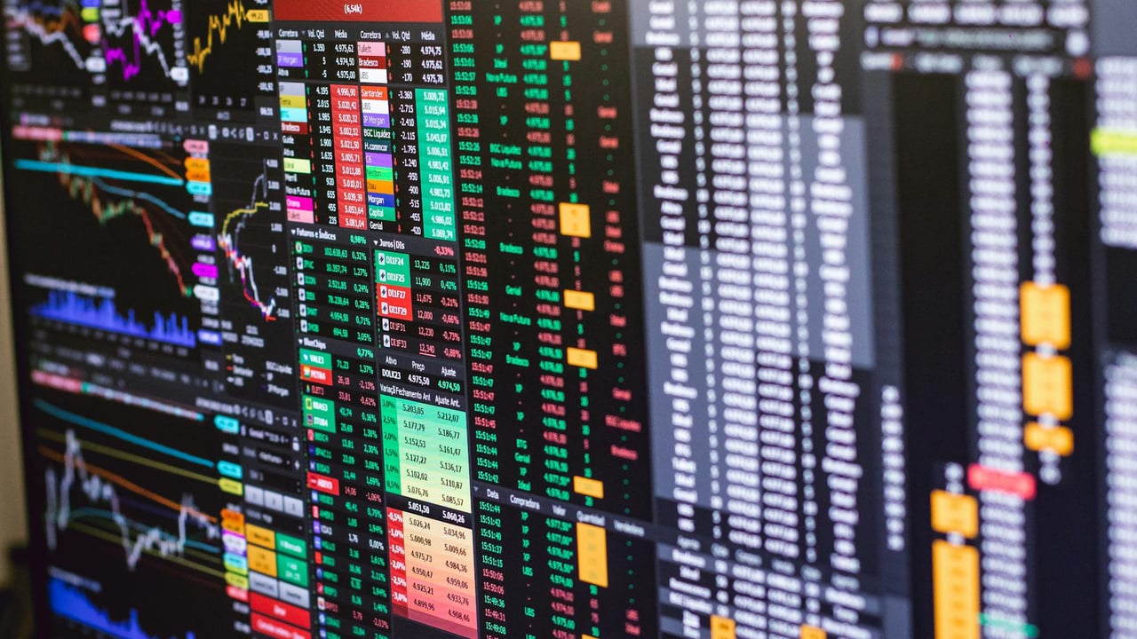 Detailed financial trading screen with colorful charts and data representing market fluctuations.
