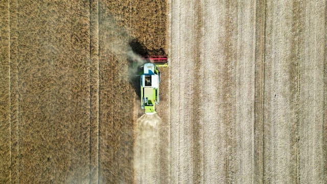 Drone shot of a combine harvester working in a wheat field in Garešnica, Croatia.
